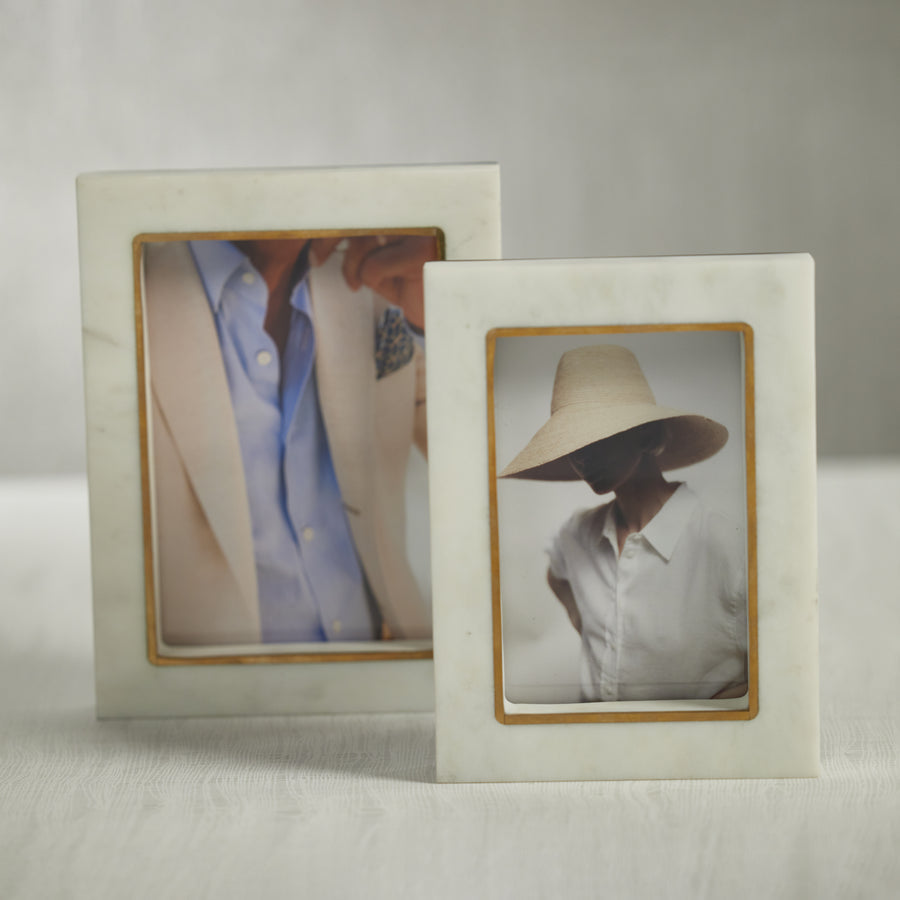 Photo frames styled in a considered interior